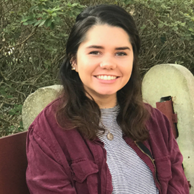 Image of Brianna sitting on bench