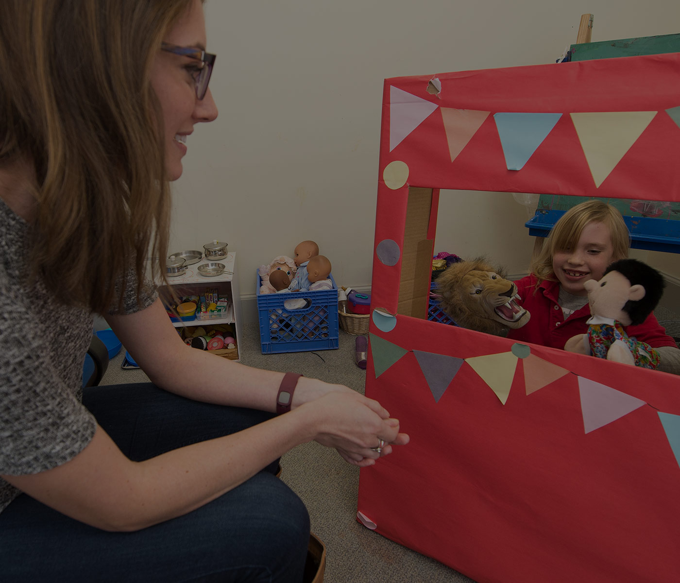 Student conducting play therapy session with child