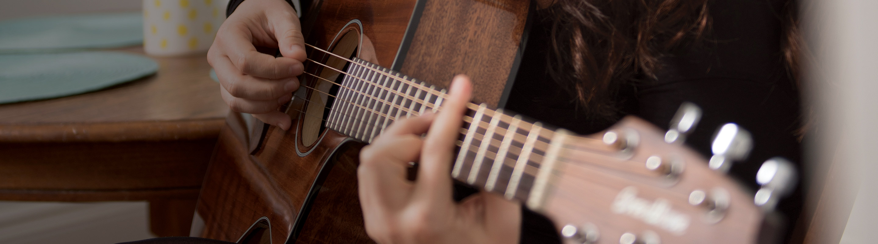 Playing an acoustic guitar
