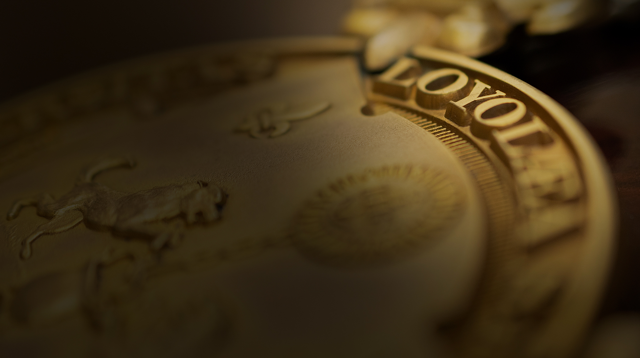 closeup of Loyola seal engraved on the president's medal