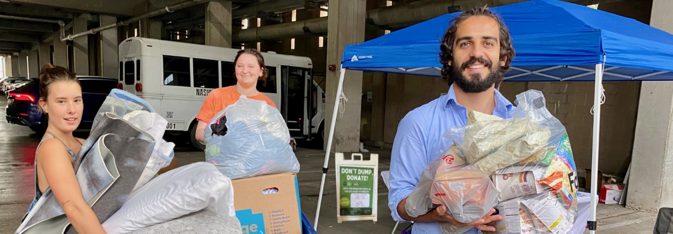 A group of individuals carrying out bags of waste